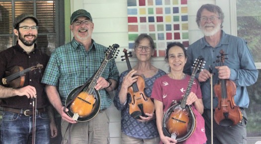 people holding musical stringed instruments 