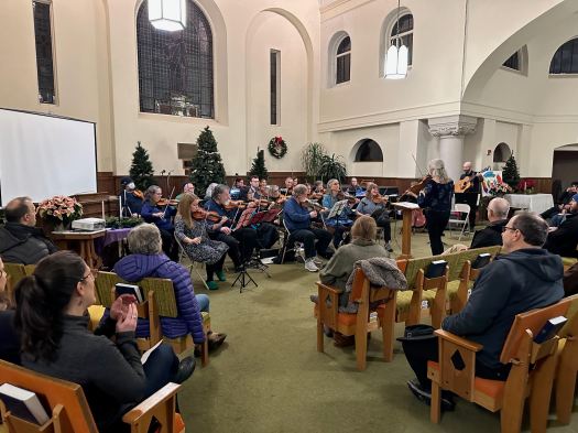 Finger Lakes Fiddle Orchestra Concert December 2024 with people playing stringed instruments