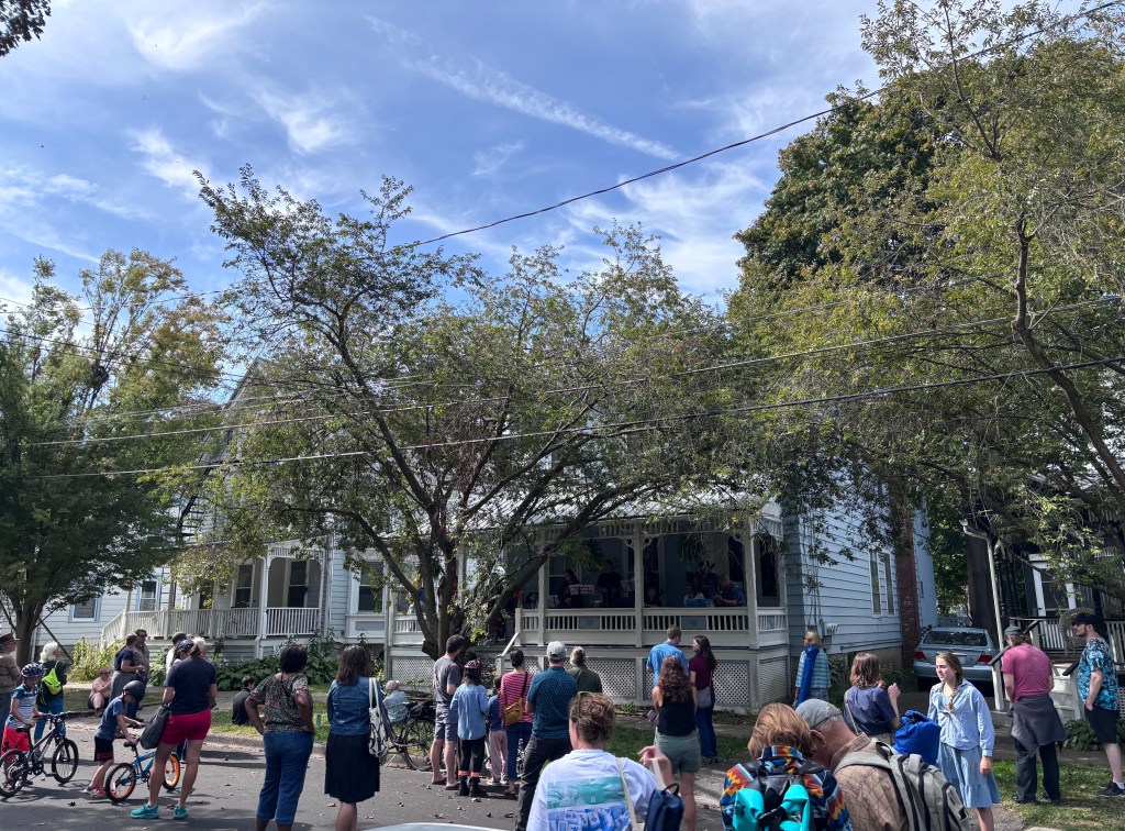 Finger Lakes Fiddle Orchestra group playing at Porchfest in Ithaca September 2025.
