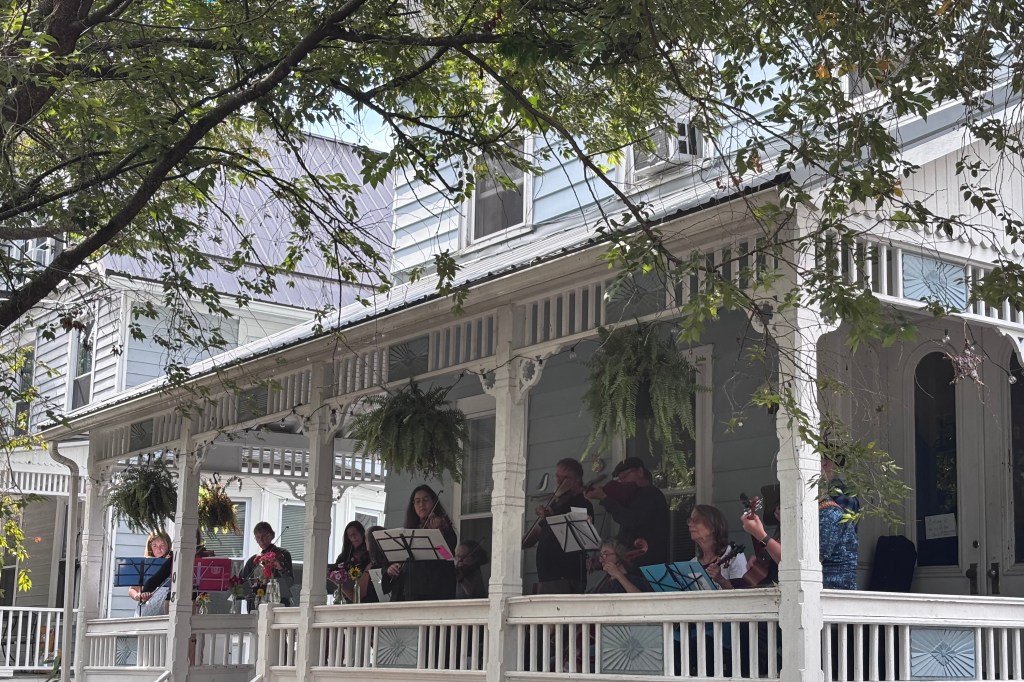 Finger Lakes Fiddle Orchestra group playing at Porchfest in Ithaca September 2025.